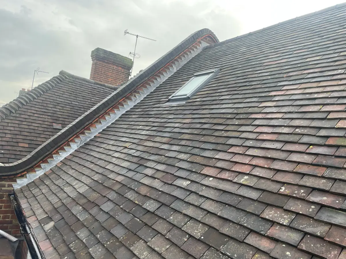 Clay tile roof with a roof window