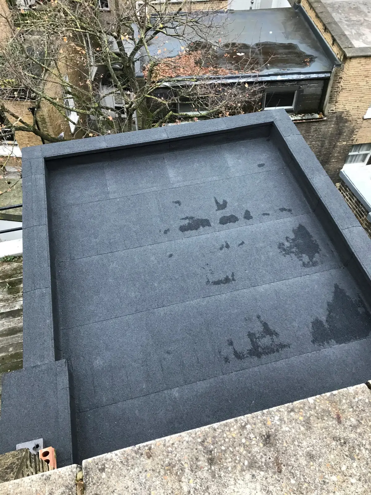 Felt flat roof with a new upstand