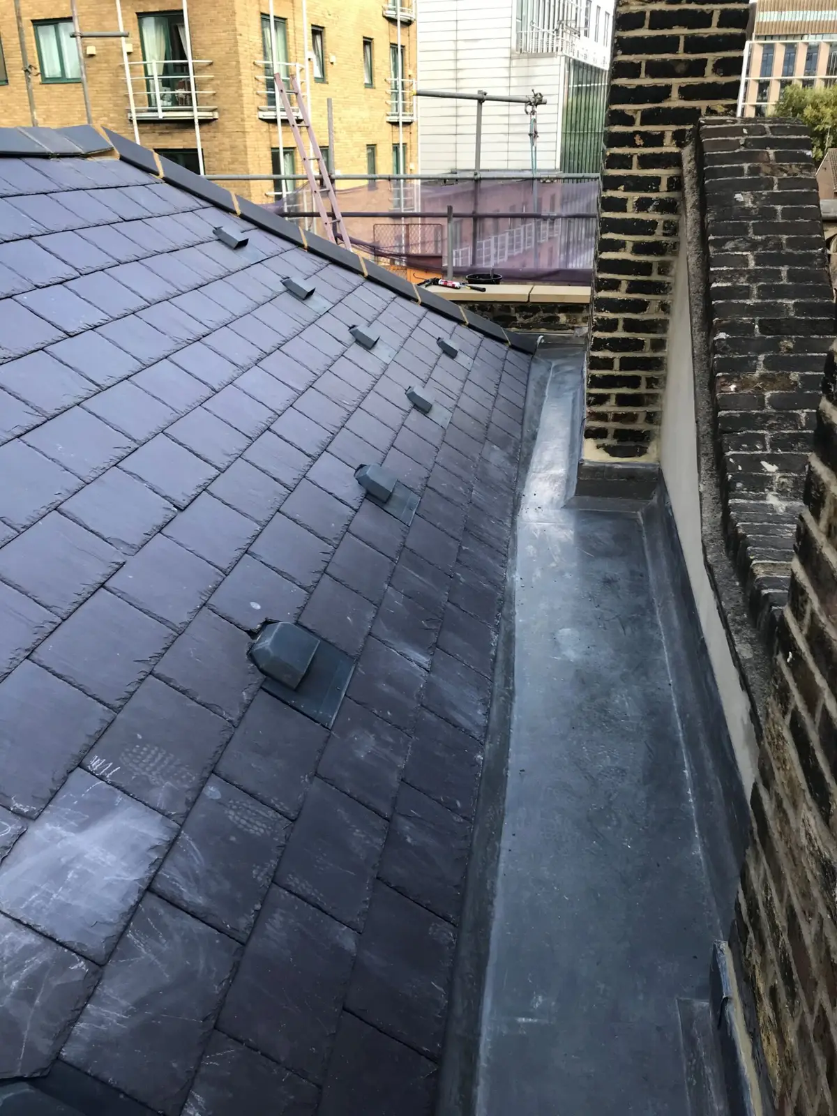Slate roof with a lead-lined valley