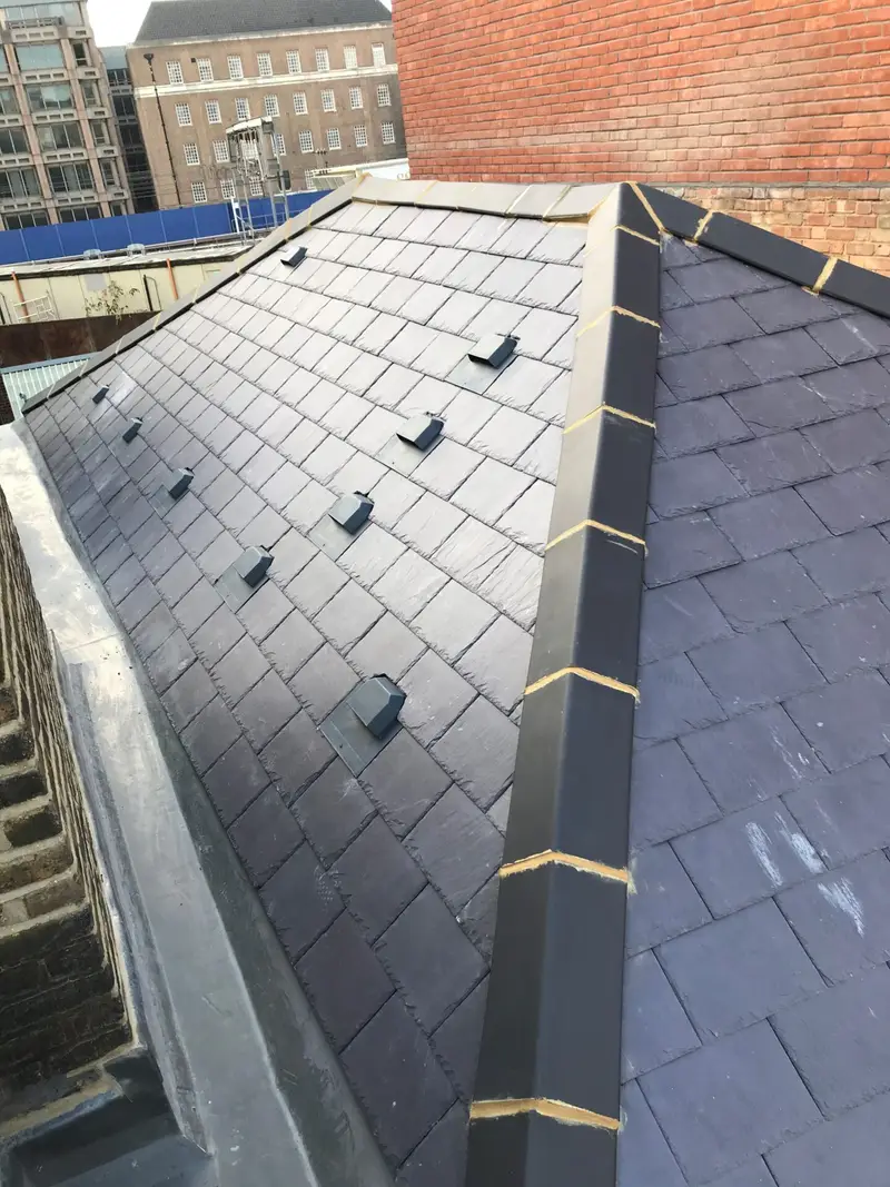 Slate roof with a lead-lined valley
