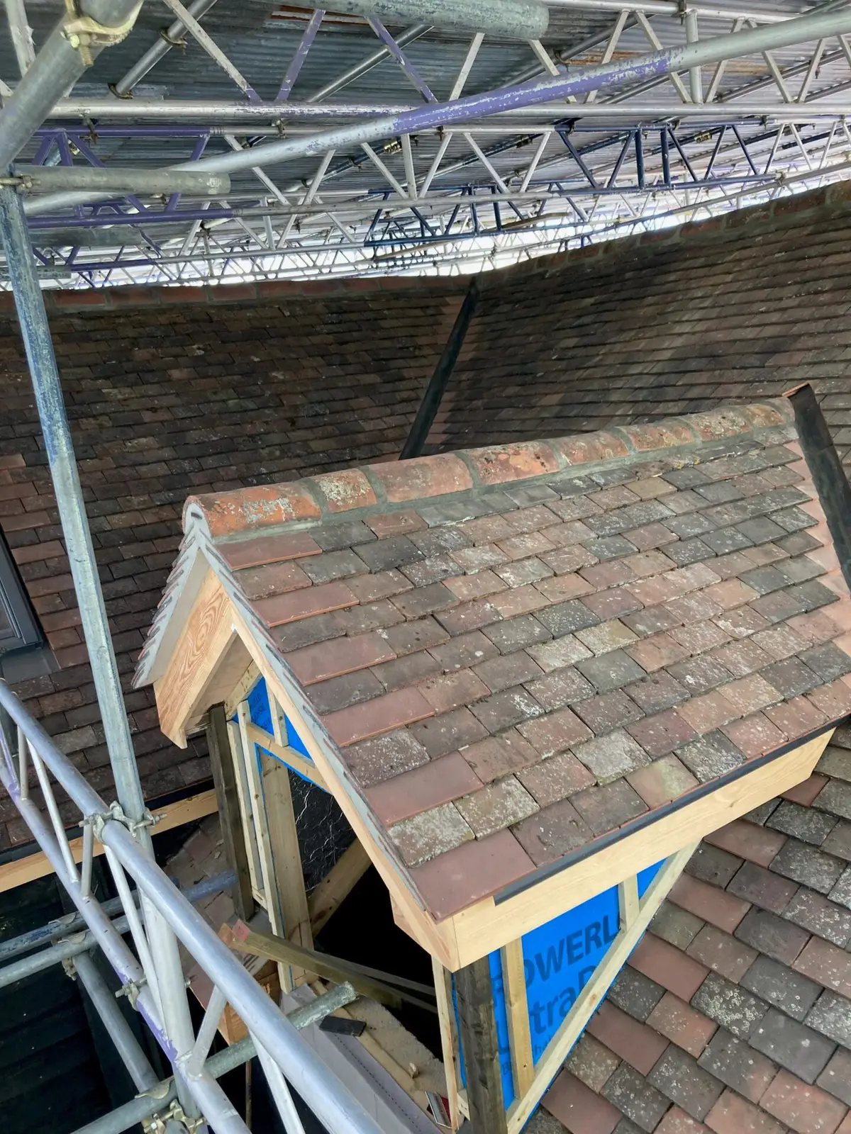 Tiled dormer under scaffold